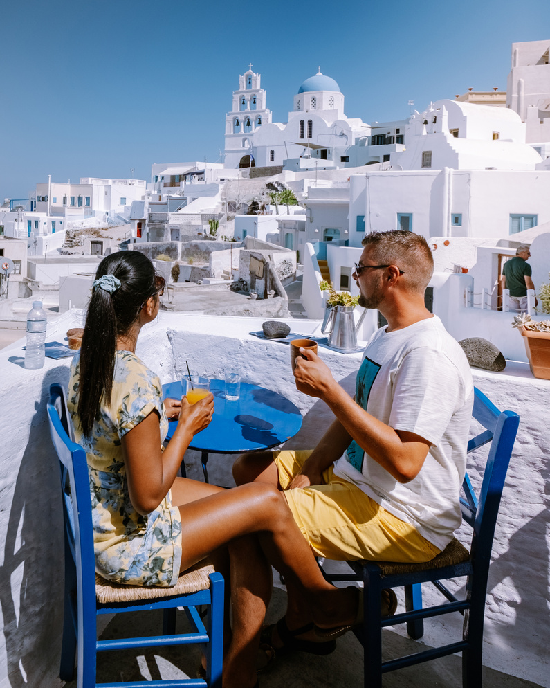 Couple Having Drinks in Santorini, Greece
